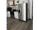 Modern kitchen featuring stainless steel refrigerator and white cabinetry at 735 Brookwood Dr, Forest Park, GA 30297