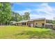Home with a spacious backyard, fence, and lots of trees at 9959 Point View Dr, Jonesboro, GA 30238