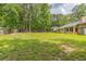 Home with a spacious backyard, fence, and lots of trees at 9959 Point View Dr, Jonesboro, GA 30238