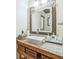 Bathroom featuring a framed mirror and a white vessel sink at 9959 Point View Dr, Jonesboro, GA 30238