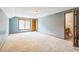 Spacious bedroom features neutral carpet, natural light, and ensuite bath access at 9959 Point View Dr, Jonesboro, GA 30238