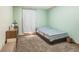 Bedroom with carpeted floors, a window, and closet with curtain at 9959 Point View Dr, Jonesboro, GA 30238