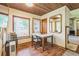 Dining area with wood floors, large windows and a view of the backyard at 9959 Point View Dr, Jonesboro, GA 30238