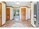 Inviting foyer with wood floors, trim, and doors leading into the living area at 9959 Point View Dr, Jonesboro, GA 30238