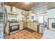 Modern kitchen featuring stainless steel appliances, granite countertops, and wood flooring at 9959 Point View Dr, Jonesboro, GA 30238