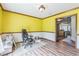 Versatile home office space with wooden flooring and a view into the kitchen at 9959 Point View Dr, Jonesboro, GA 30238