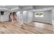 Finished basement featuring a staircase and modern vinyl flooring at 385 Vineyard Nw Dr, Marietta, GA 30064