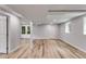 Finished basement featuring recessed lighting, light gray walls, modern vinyl flooring, and exterior access at 385 Vineyard Nw Dr, Marietta, GA 30064