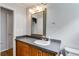Bathroom featuring a vintage vanity with modern countertop, large mirror, and soft grey wall color at 385 Vineyard Nw Dr, Marietta, GA 30064