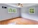 Bedroom featuring wood floors, large windows, and neutral wall color at 385 Vineyard Nw Dr, Marietta, GA 30064