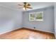 Bedroom featuring wood floors, a window, and neutral wall color at 385 Vineyard Nw Dr, Marietta, GA 30064