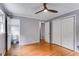 Bright bedroom with hardwood floors, neutral wall color, and two closets at 385 Vineyard Nw Dr, Marietta, GA 30064