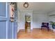 Inviting foyer with hardwood floors, modern light fixture, and a glimpse into the dining area at 385 Vineyard Nw Dr, Marietta, GA 30064