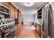 Updated kitchen featuring stainless appliances, wood cabinets, tile backsplash, and adjoining dining area at 385 Vineyard Nw Dr, Marietta, GA 30064