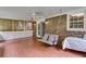Relaxing screened porch with brick flooring, swing, fan, and outdoor seating perfect for entertaining guests at 385 Vineyard Nw Dr, Marietta, GA 30064