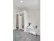 The spacious bathroom has a garden tub, shower, gray tile, and modern fixtures at 1075 Litchfield Sw Way, Marietta, GA 30060