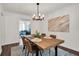 Formal dining room with stylish light fixture and modern decor at 1075 Litchfield Sw Way, Marietta, GA 30060