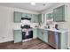 Updated kitchen featuring stainless steel appliances and bright countertops at 1075 Litchfield Sw Way, Marietta, GA 30060