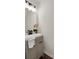 Stylish powder room features a modern vanity, sleek fixtures, and hardwood floors at 1075 Litchfield Sw Way, Marietta, GA 30060