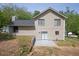 View of home's rear featuring a cozy back patio area at 1147 Williamsburg Ln, Norcross, GA 30093