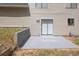Backyard patio with sliding glass doors offer seamless indoor-outdoor living at 1147 Williamsburg Ln, Norcross, GA 30093