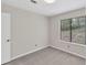Bedroom with natural light, plush carpet, neutral walls, and a view of the exterior at 1147 Williamsburg Ln, Norcross, GA 30093