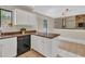 Functional kitchen with a breakfast bar, access to the deck, and ample cabinet space at 1147 Williamsburg Ln, Norcross, GA 30093