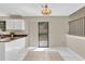 Bright kitchen and dining area, complete with stone countertops and sliding door to outside deck at 1147 Williamsburg Ln, Norcross, GA 30093
