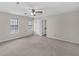 Spacious main bedroom featuring neutral walls, carpet, ceiling fan and windows to let in natural light at 1147 Williamsburg Ln, Norcross, GA 30093