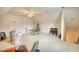 Spacious attic featuring a ceiling fan and ample room for storage or potential conversion, with a door leading to additional space at 205 Summer Walk Dr, Covington, GA 30016