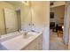 Bright bathroom with vanity and mirror leading into another room at 205 Summer Walk Dr, Covington, GA 30016