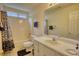 Cozy bathroom featuring patterned shower curtain, vanity, and convenient toilet at 205 Summer Walk Dr, Covington, GA 30016