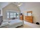 Charming bedroom with vaulted ceilings and a bay window allowing for lots of natural light at 205 Summer Walk Dr, Covington, GA 30016