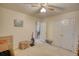 Bedroom with neutral walls, carpet and white closet doors, offering a simple and clean space at 205 Summer Walk Dr, Covington, GA 30016