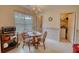 Charming breakfast nook with a table and chairs, a window view, and a vintage-style chandelier at 205 Summer Walk Dr, Covington, GA 30016