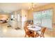 Quaint breakfast nook with a table and chairs set in front of a large window offering views of the yard at 205 Summer Walk Dr, Covington, GA 30016