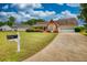 Charming one-story home with well-manicured lawn and a two-car garage on a sunny day at 205 Summer Walk Dr, Covington, GA 30016
