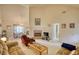 Inviting living room features vaulted ceilings, a brick fireplace, and comfortable seating area at 205 Summer Walk Dr, Covington, GA 30016
