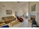 Spacious living room with vaulted ceiling, brick fireplace, and comfortable furnishings at 205 Summer Walk Dr, Covington, GA 30016
