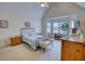 Comfortable main bedroom with bay window, sloped ceilings and ceiling fan at 205 Summer Walk Dr, Covington, GA 30016
