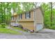 Exterior of home with garage and a concrete driveway with sidewalk and attractive yard at 3452 Chesterfield Ct, Snellville, GA 30039