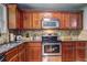 Gourmet kitchen with stone backsplash, granite countertops and stainless steel appliances at 3452 Chesterfield Ct, Snellville, GA 30039