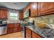 Kitchen showcasing granite countertops, stainless steel appliances, and wooden cabinetry at 3452 Chesterfield Ct, Snellville, GA 30039