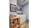 Well-organized laundry room with modern appliances, shelf storage, and a clean look at 3452 Chesterfield Ct, Snellville, GA 30039