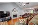 Spacious living area with a fireplace, hardwood floors, and an adjacent dining area at 3452 Chesterfield Ct, Snellville, GA 30039