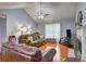 Inviting living room with vaulted ceilings, hardwood floors, a fireplace, and comfortable seating at 3452 Chesterfield Ct, Snellville, GA 30039