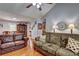 Cozy living room showing sofas, wood flooring, and access to a dining area at 3452 Chesterfield Ct, Snellville, GA 30039
