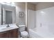 Bathroom featuring a single sink vanity, and a tub-shower combo with tile surround at 965 Mulberry Bay Dr, Dacula, GA 30019
