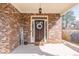 Quaint brick front porch featuring a decorative wreath and 'WELCOME' sign for added charm at 965 Mulberry Bay Dr, Dacula, GA 30019