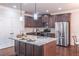 Modern kitchen with stainless steel appliances, granite countertops, and a large center island at 965 Mulberry Bay Dr, Dacula, GA 30019